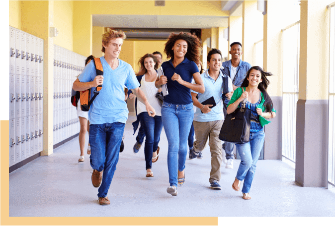 Students running happily in school hallway